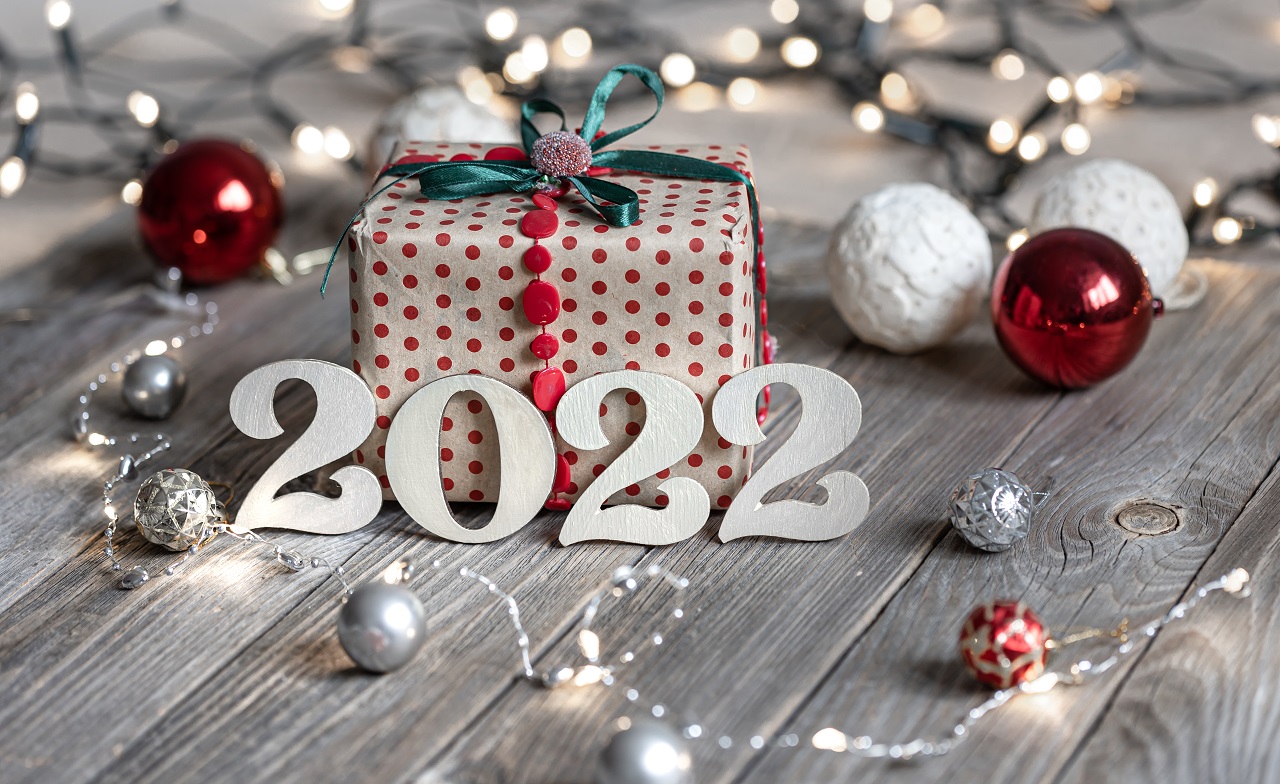 Festive Christmas Background With Decorative Numbers 2022 And Gift Box.