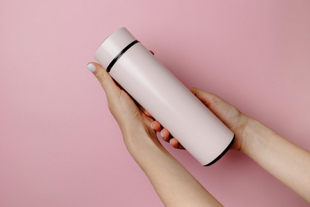 Woman Is Holding Pink Thermos